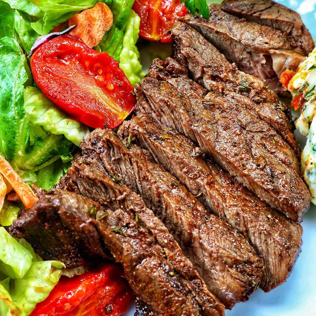 filet mignon sliced with salad.
