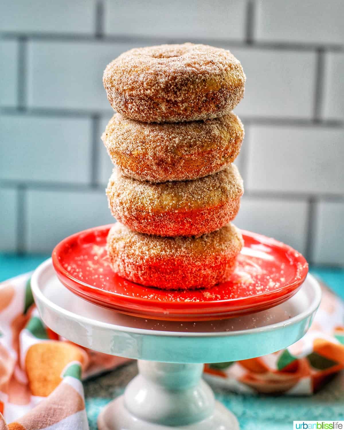 stack of apple cinnamon donuts on orange pan