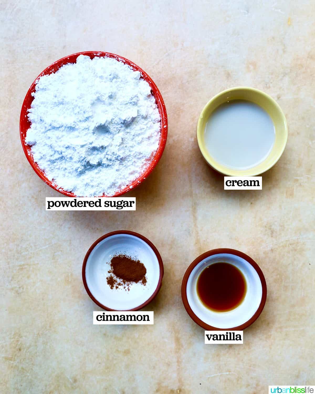 bowls of ingredients to make a cinnamon glaze for apple fritters doughnuts.