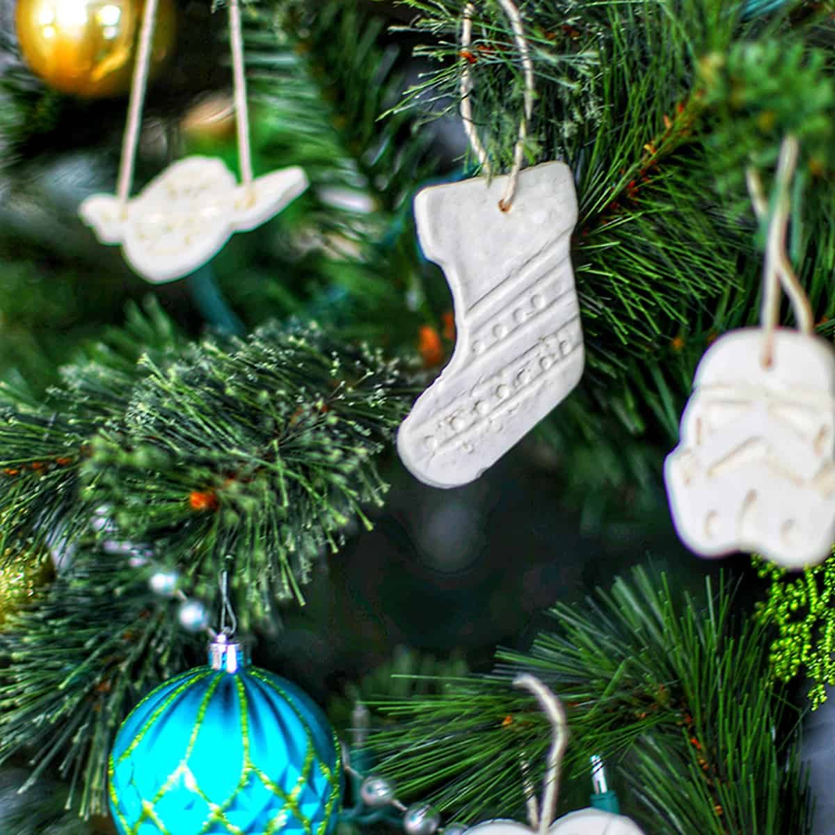 baking soda ornaments hanging on a christmas tree.