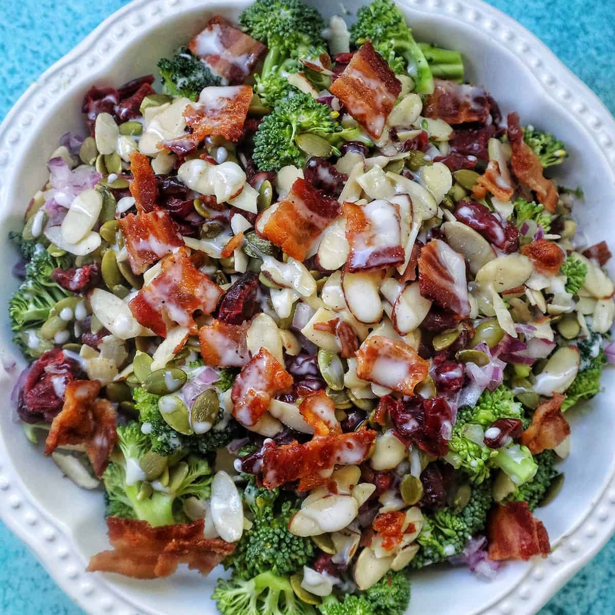 broccoli crunch salad in a white bowl.