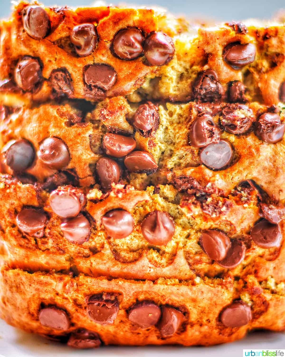 stack of sliced chocolate chip banana bread with loaded chocolate chips.