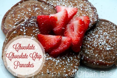 Chocolate chocolate chip pancakes are a decadent, tasty way to celebrate special mornings! Recipe on UrbanBlissLife.com