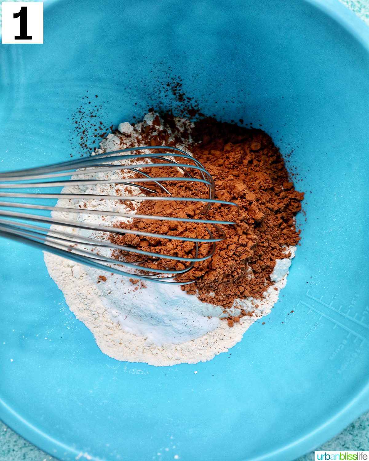 dry ingredients to make double chocolate coffee cookies in a blue bowl.