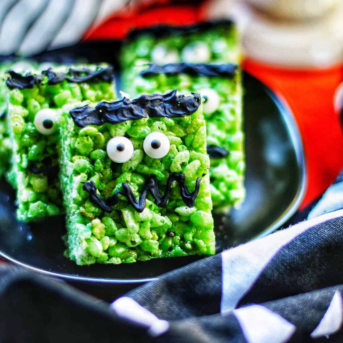 green frankenstein marshmallow rice krispie treats on a plate.