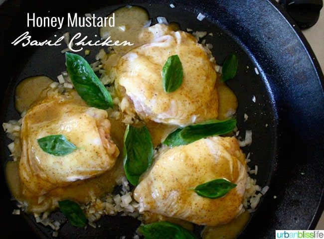 chicken thighs in skillet with basil