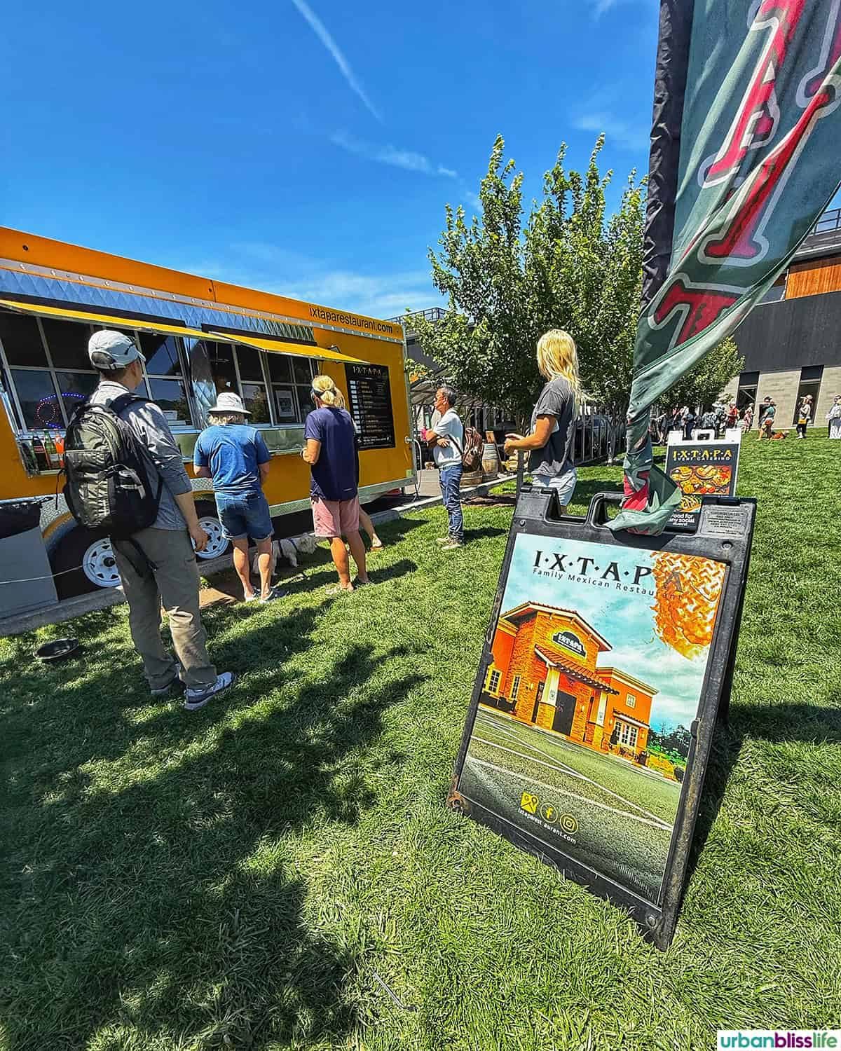 outdoor food trucks and lines at the Hood River waterfront.