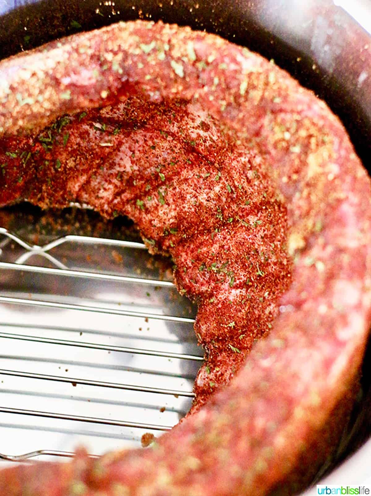 seasoned baby back pork ribs inside an Pressure-cooker.