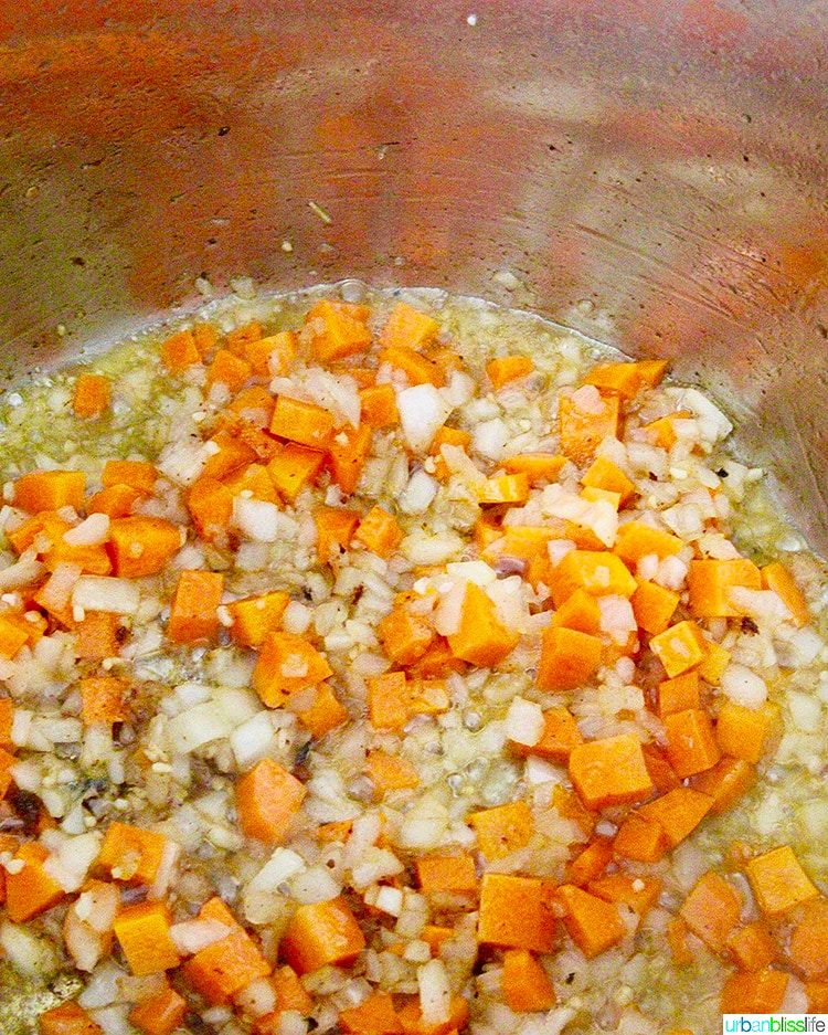 carrots, onions, garlic sauteeing in Pressure-cooker