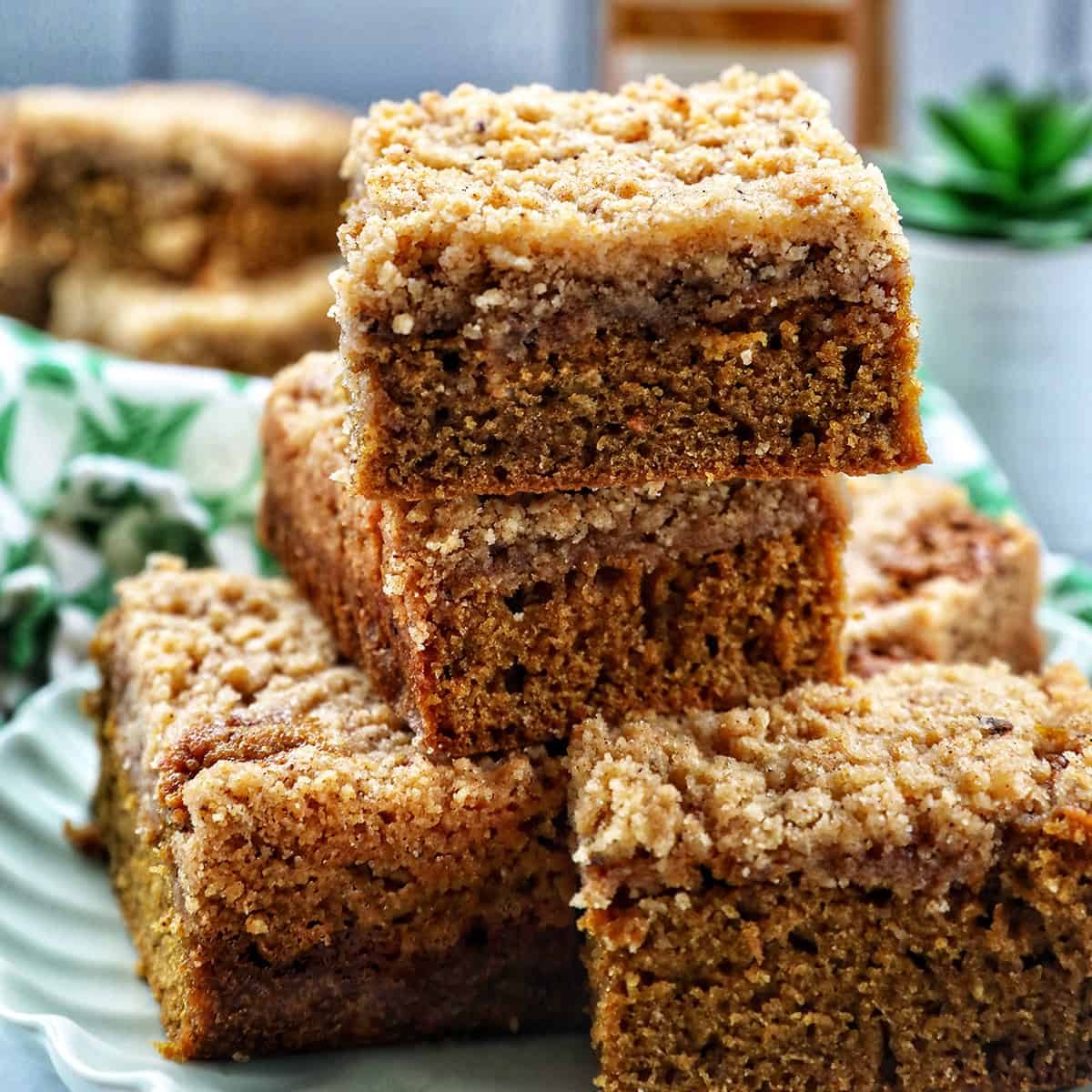 stack of Irish coffee cake on a green plate with green patterned napkins.