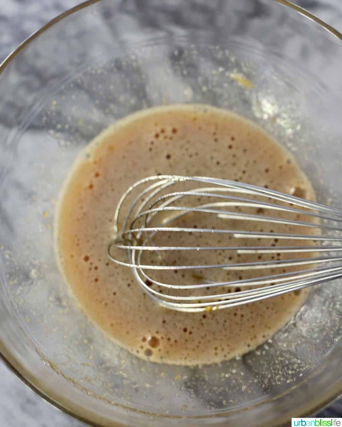 whisking ingredients for mini pecan pies