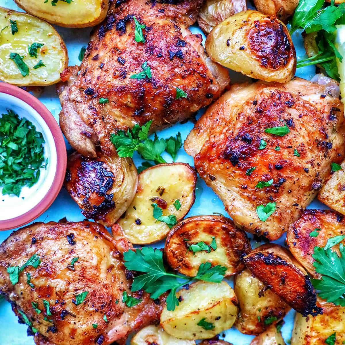 chicken and potatoes garnished with parsley.