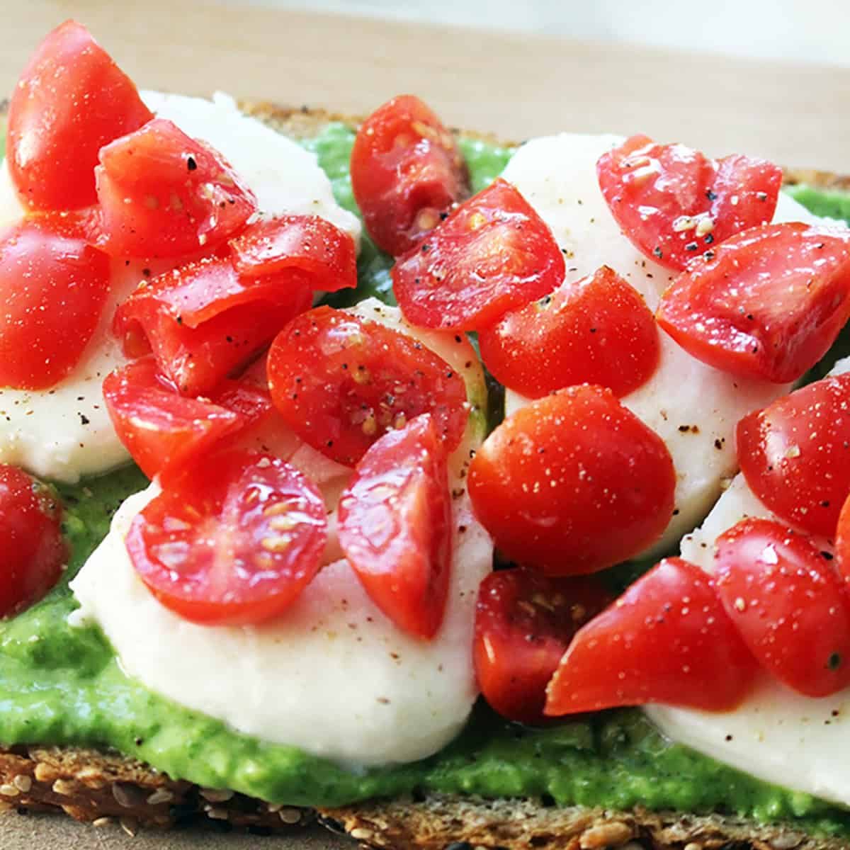 caprese tartines with avocado pesto spread