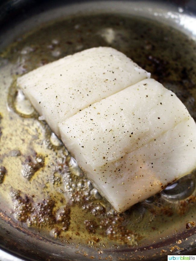 Wild Alaskan Halibut Poached with Tomatoes and Peas Wine Sauce, recipe on UrbanBlissLife.com
