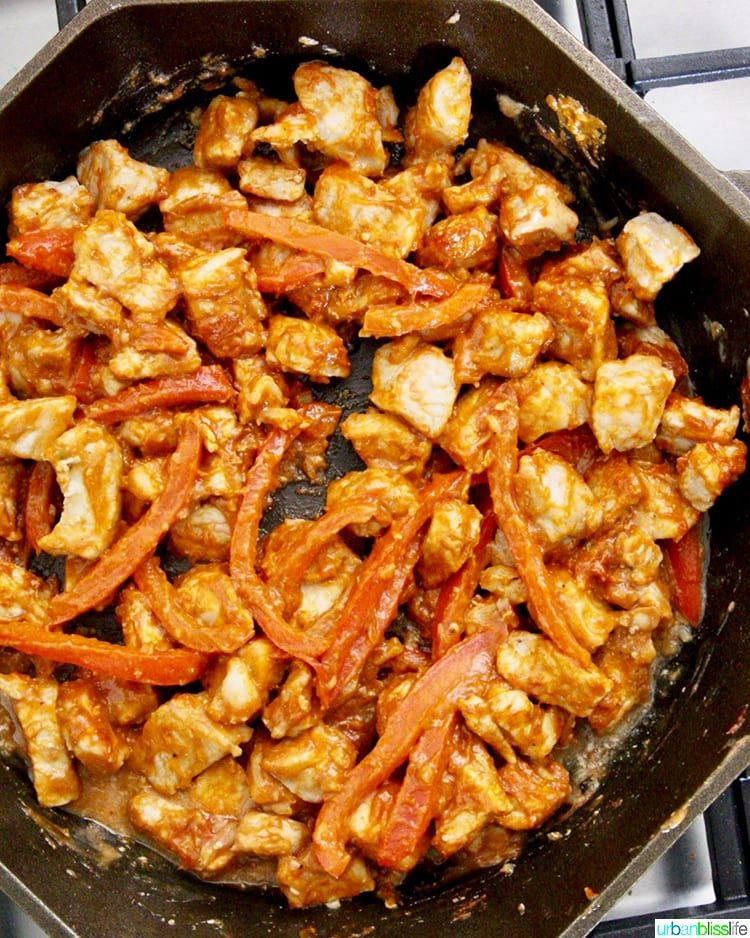 pork and red peppers in skillet