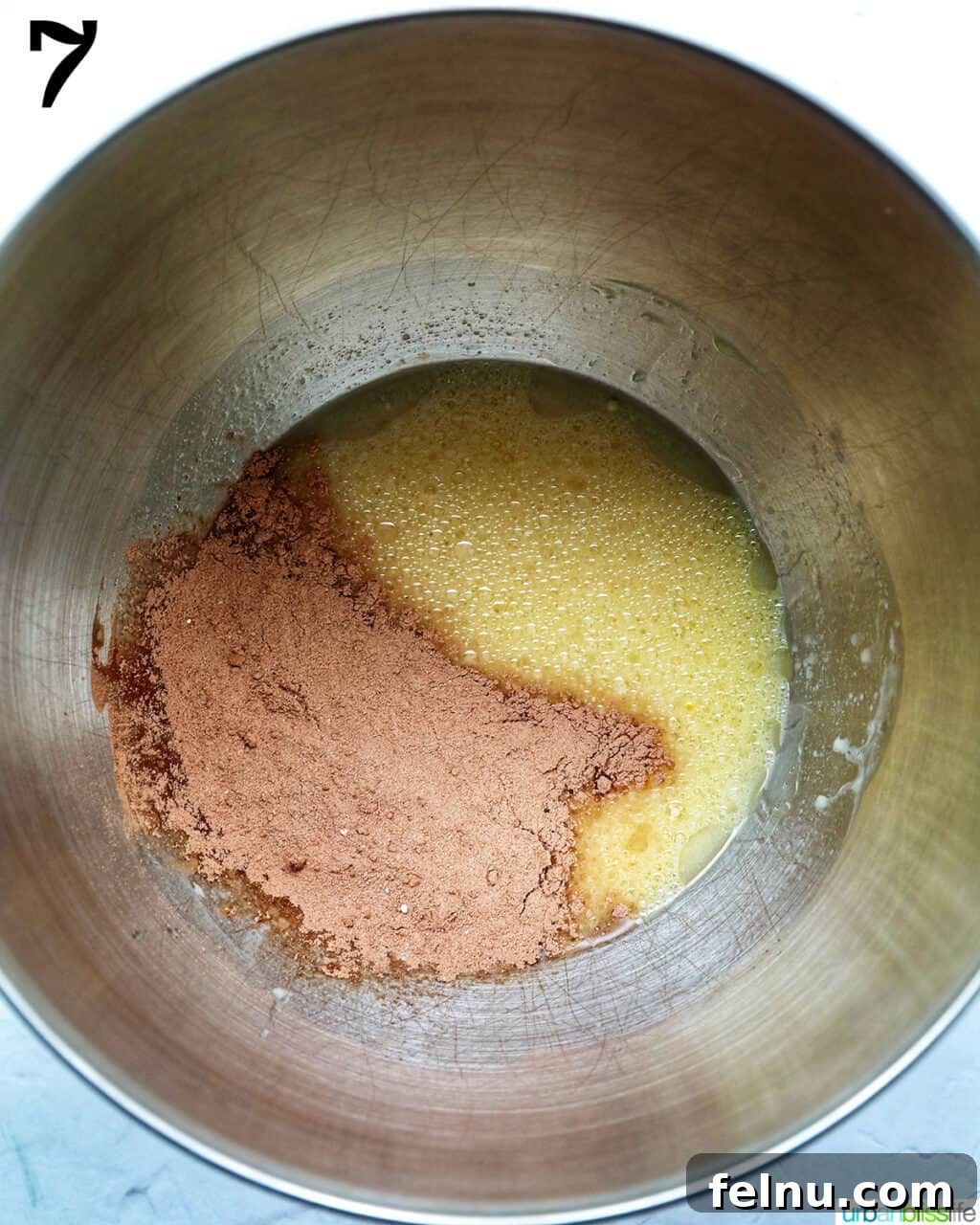 Velvet Chocolate Fudge Cupcakes 13 cocoa powder added to bowl of a stand mixer with wet ingredients to make chocolate fudge cupcakes.
