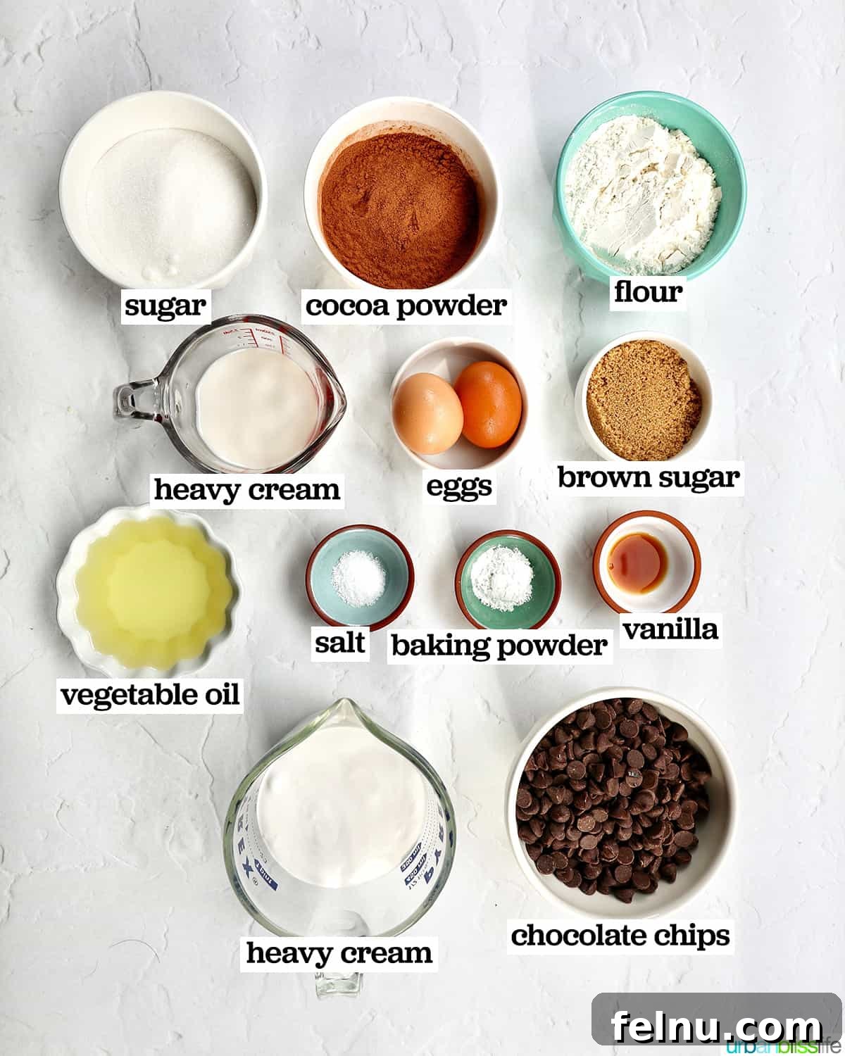 Velvet Chocolate Fudge Cupcakes 4 bowls of ingredients to make chocolate fudge cupcakes.