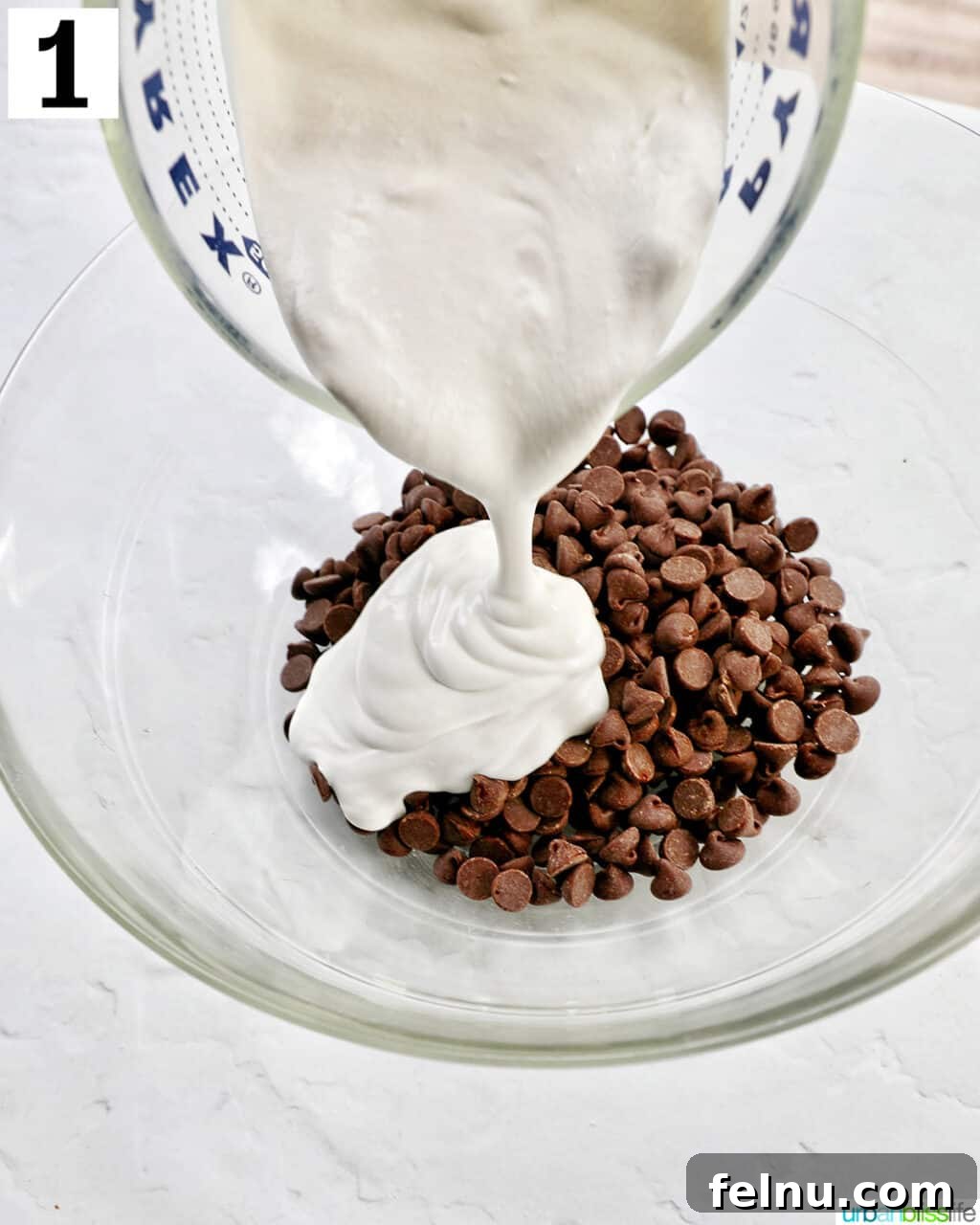 Velvet Chocolate Fudge Cupcakes 5 pouring heavy cream into a bowl with chocolate chips.