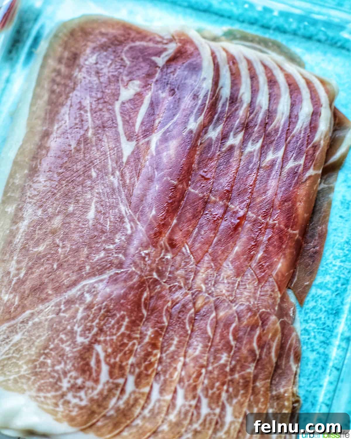 Close-up of thinly sliced prosciutto.