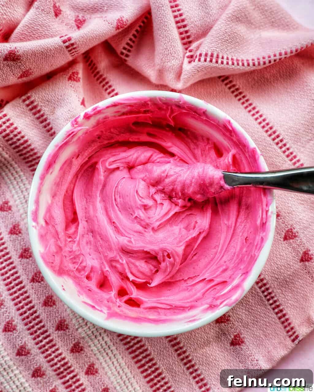 Love Struck Cookie Cake 15 bowl of bright pink frosting.