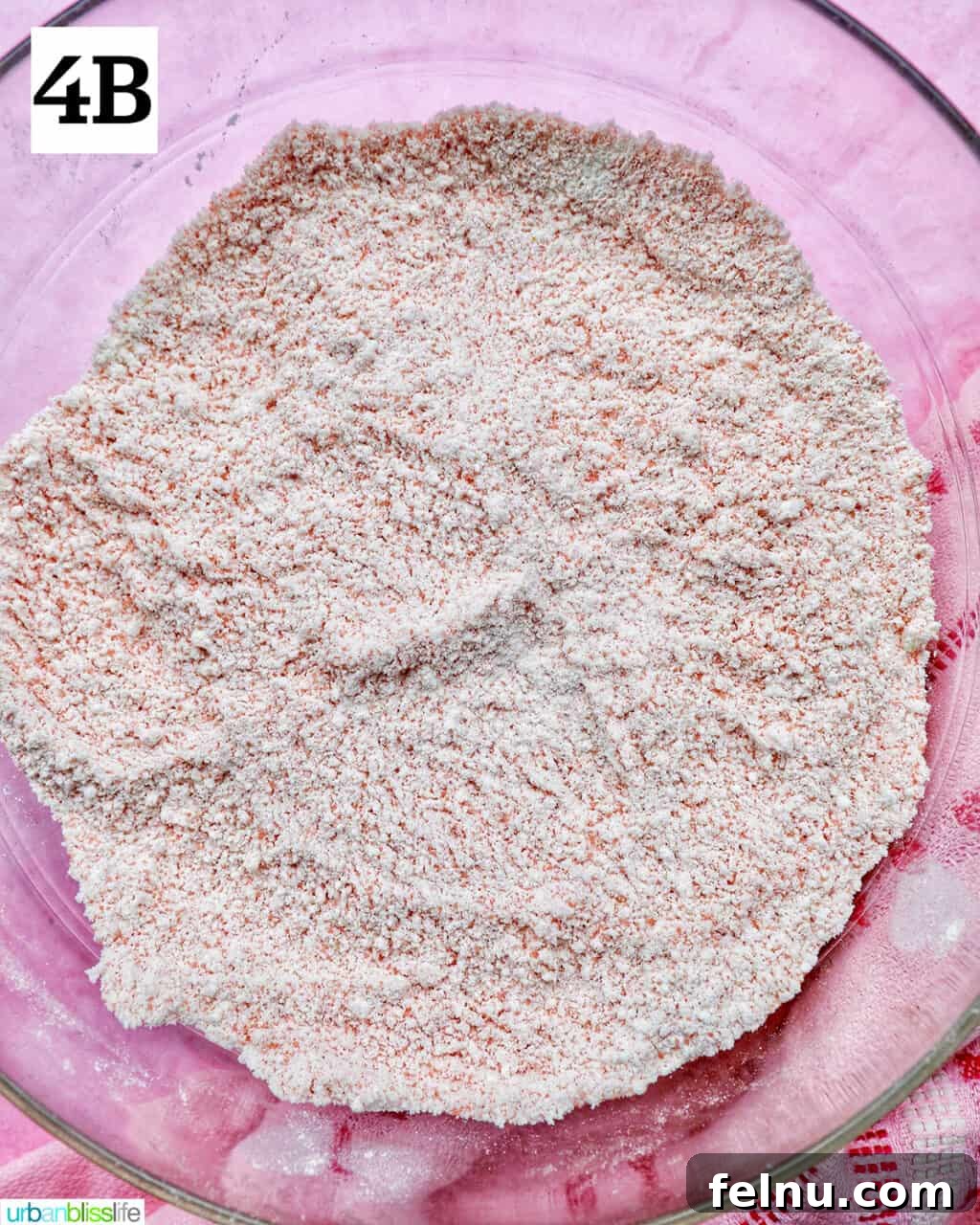 Strawberry Shortcake Crunch Cupcakes 11 Eggs and milk being whisked in a separate bowl to create the wet ingredients.