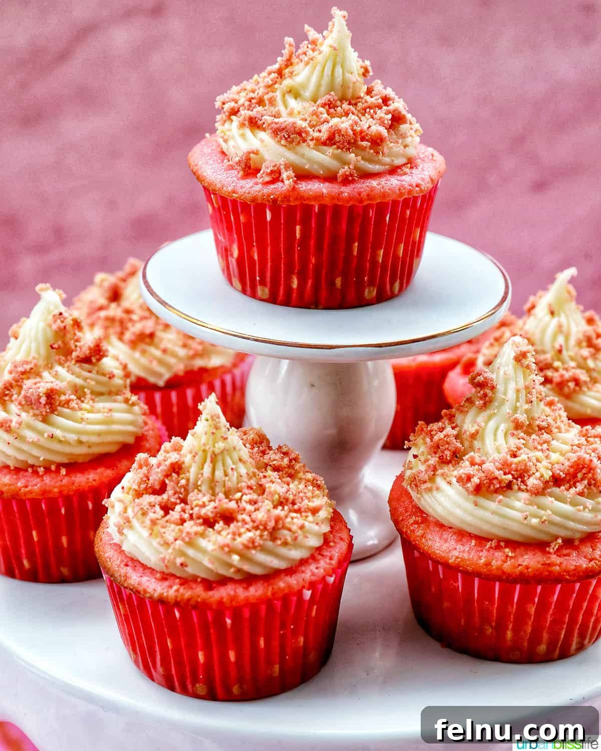 Strawberry Shortcake Crunch Cupcakes 3 Several beautifully arranged strawberry crunch cupcakes displayed on elegant stacked cupcake pedestals, ready for any celebration.