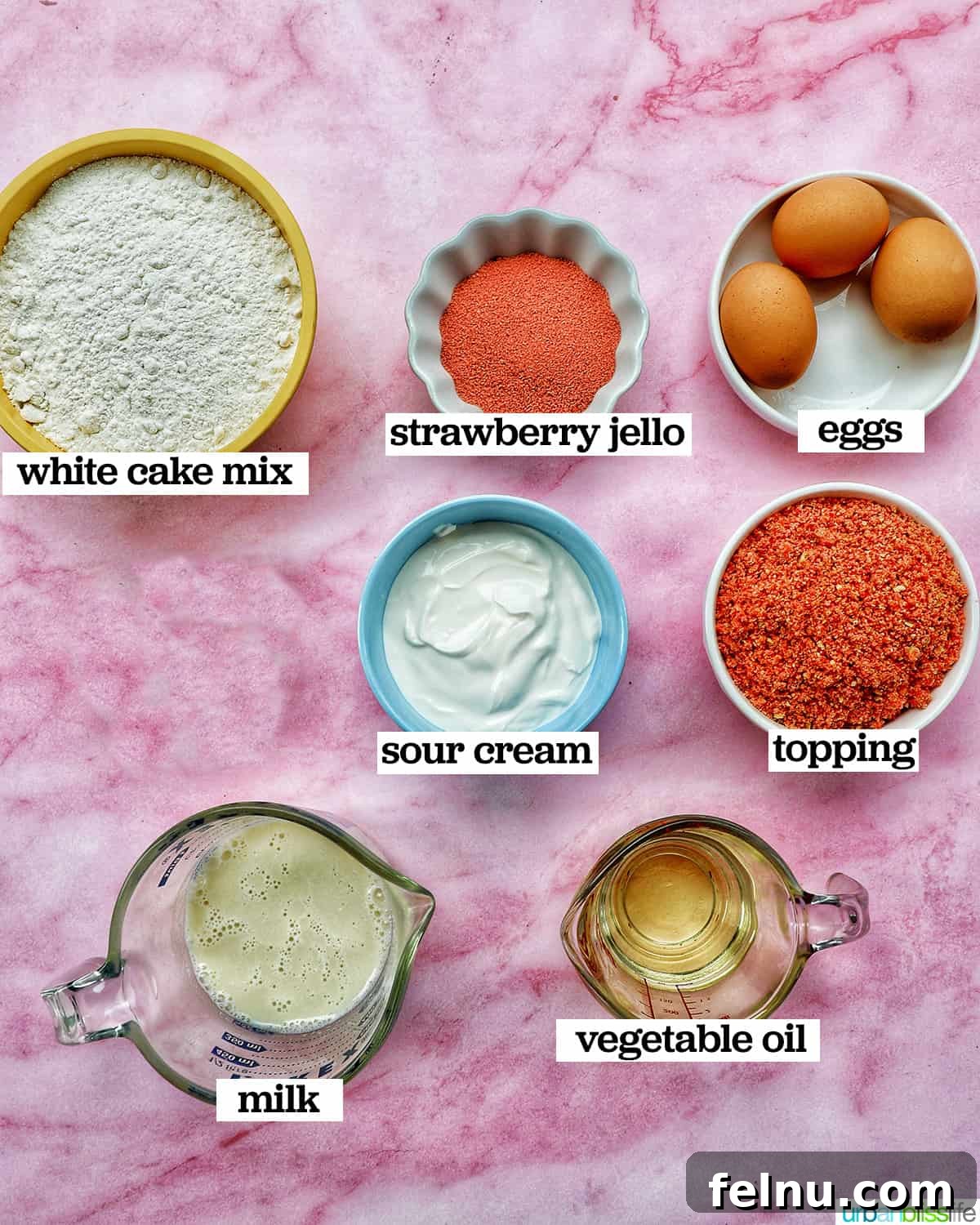 Strawberry Shortcake Crunch Cupcakes 5 A collection of bowls displaying the pre-measured ingredients essential for baking the moist and flavorful strawberry crunch cupcakes.