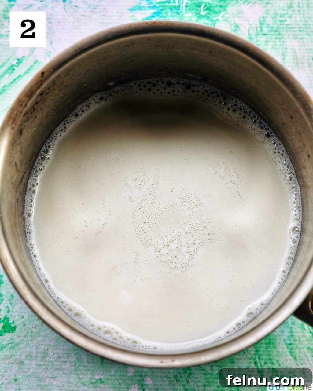 Homemade vanilla pudding in a saucepan.