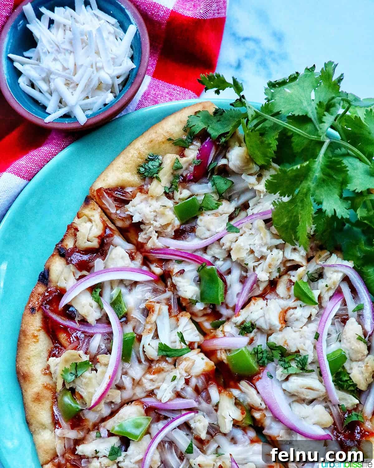 BBQ Chicken Flatbread Feast 12 Sliced BBQ chicken flatbread on a wooden board, showcasing the delicious toppings.