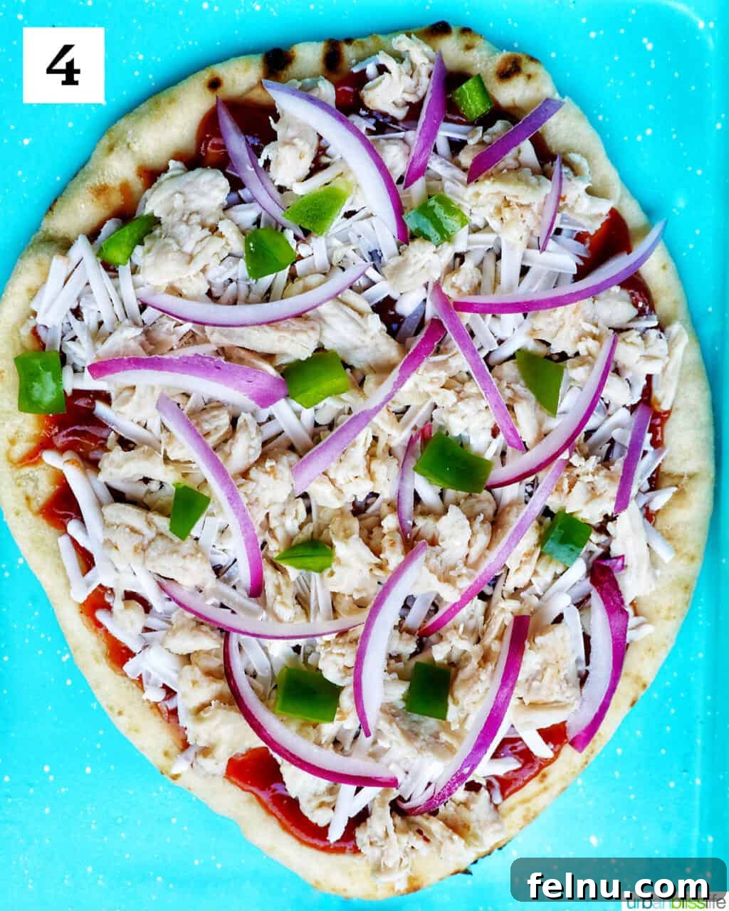 BBQ Chicken Flatbread Feast 8 Adding red onions and green peppers to the flatbread pizza.