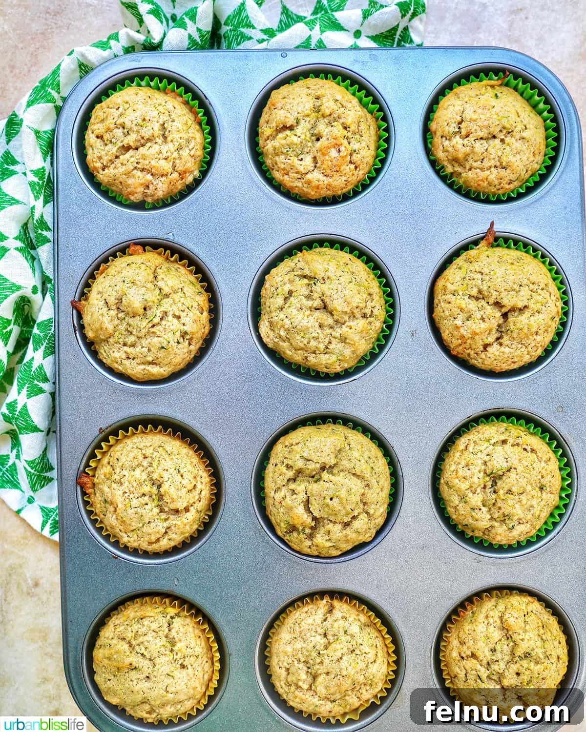 Over 25 Delicious Dairy-Free Muffins 32 Dairy-free zucchini muffins baking in a muffin tin.