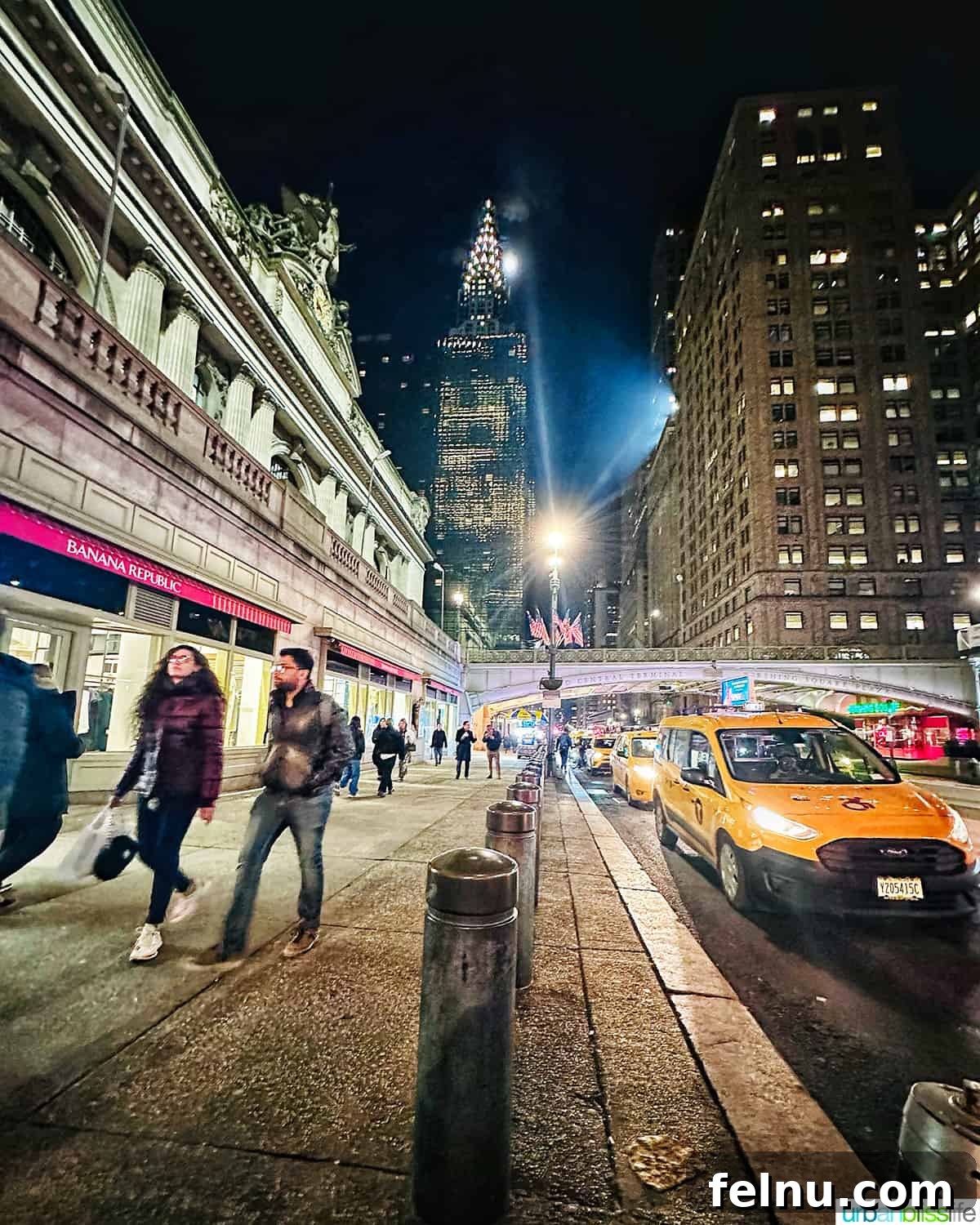 Four-Day New York City Getaway 3 Nighttime view of a New York City street with yellow taxis and the Chrysler Building in the background