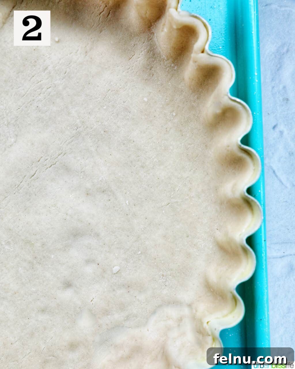 Smoked Salmon & Dill Quiche 7 A pie crust neatly pressed into a pie plate, forming a perfect base for the quiche.
