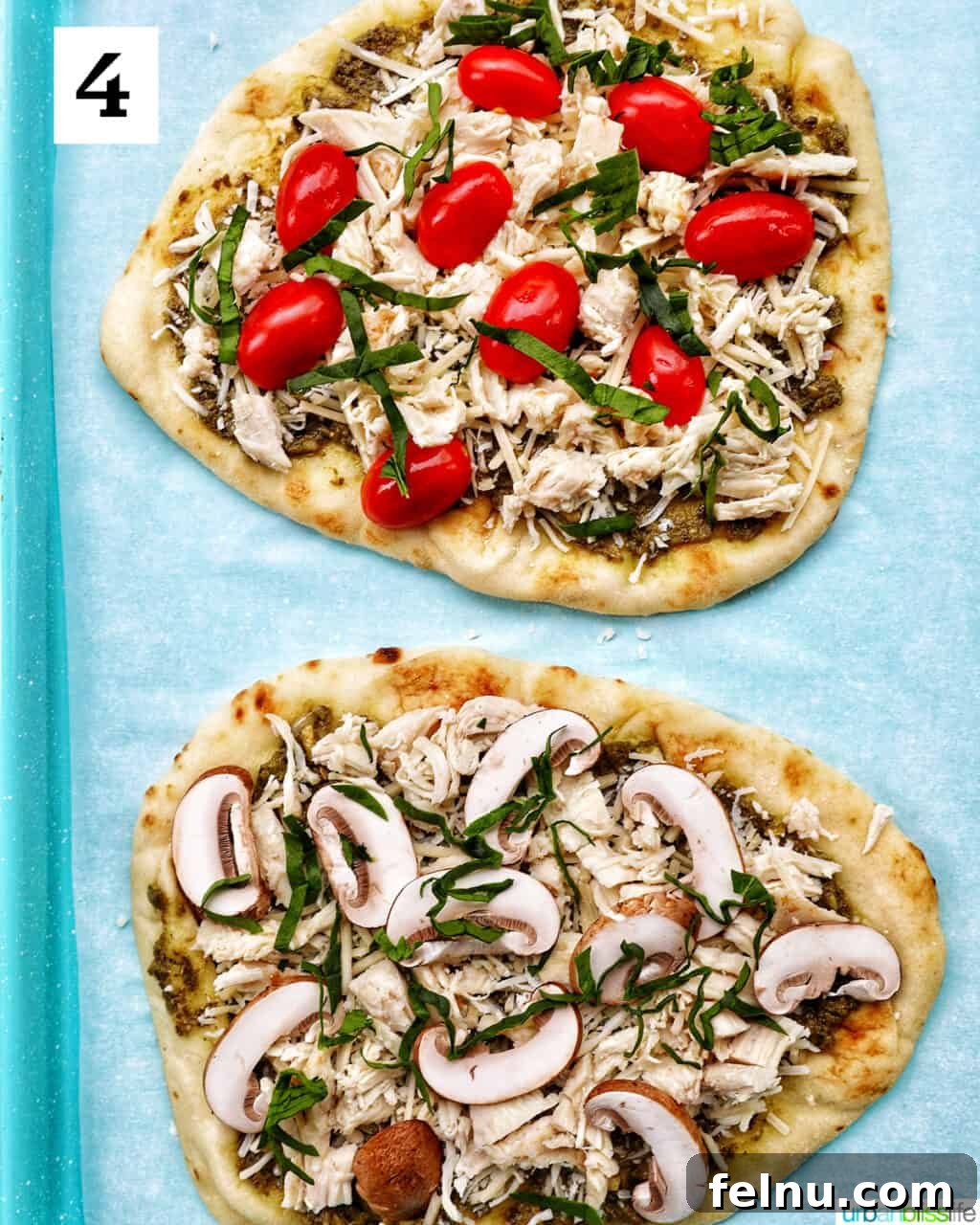 A close-up of two chicken pesto flatbreads, one adorned with juicy cherry tomatoes and the other with savory mushrooms.