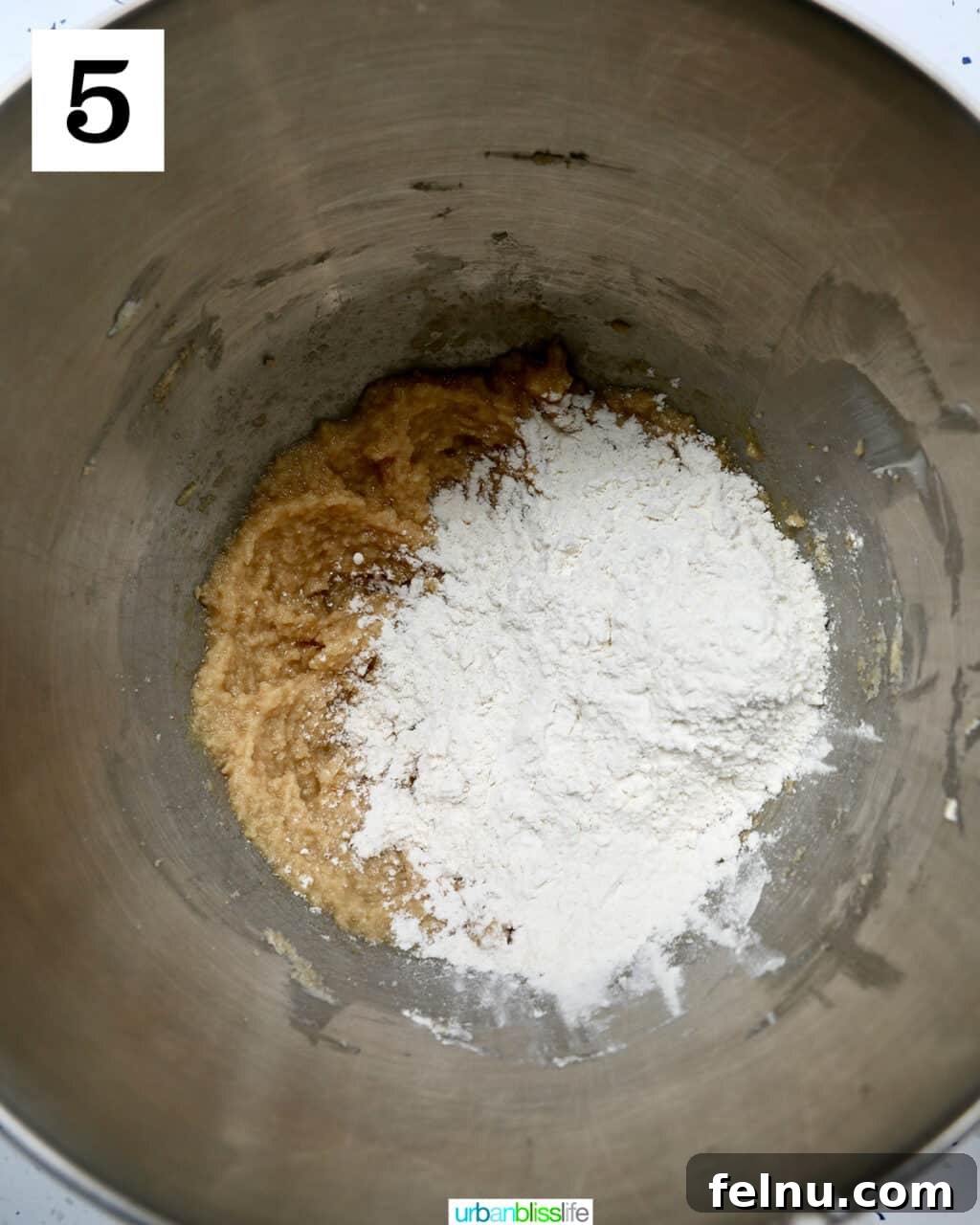 Crispy Air-Fried Delights 11 dry ingredients added to wet ingredients in a stand mixer bowl.
