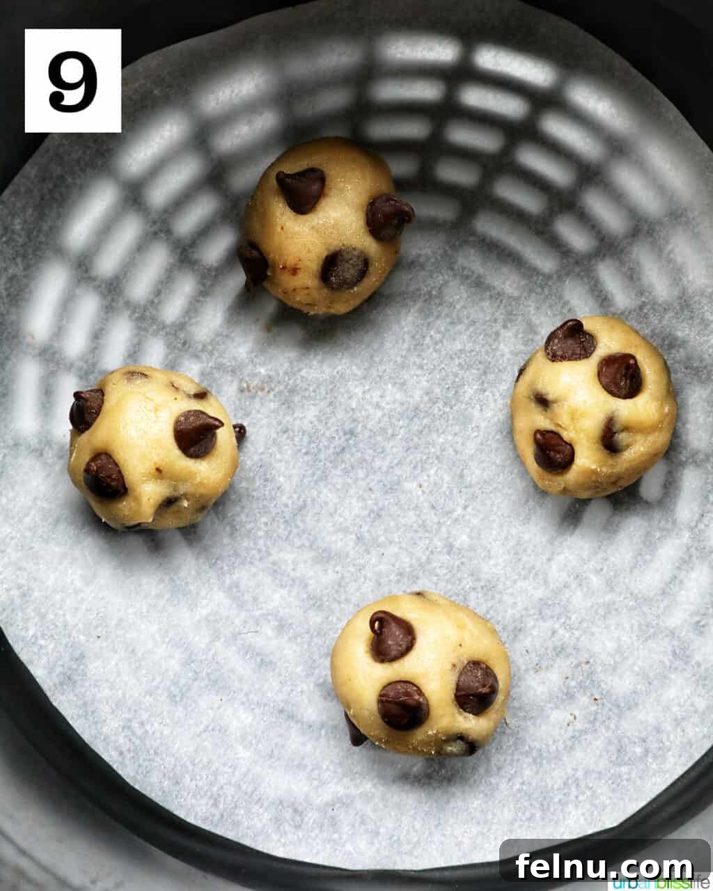 Crispy Air-Fried Delights 16 four chocolate chip cookie dough balls in an air fryer basket