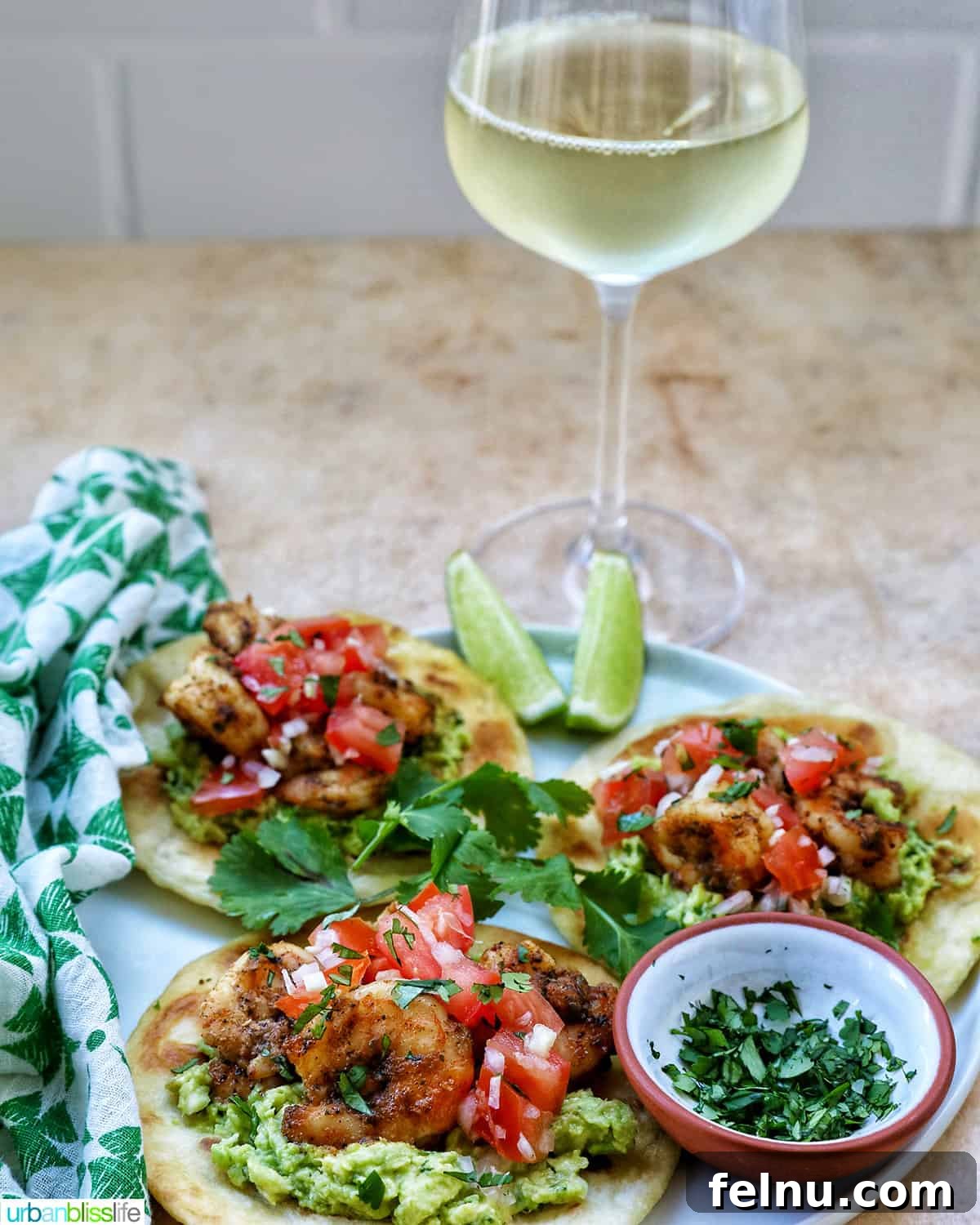 Shrimp tostadas with a glass of white wine.