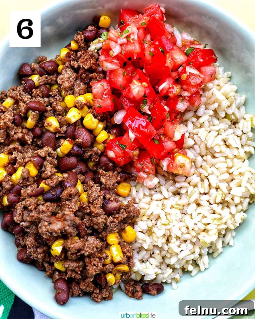 Effortless Fiesta Bowls 11 Taco bowl of brown rice, beef, beans, corn, tomatoes.