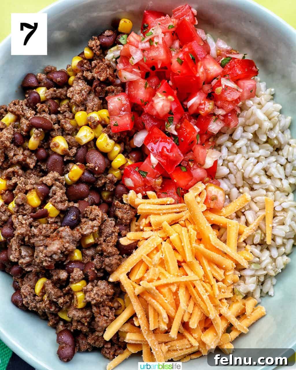 Effortless Fiesta Bowls 12 Taco bowl of brown rice, beef, beans, corn, tomatoes, cheese.