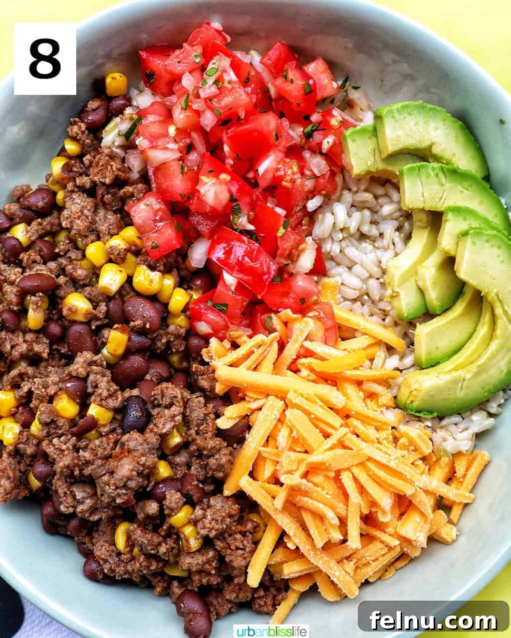 Effortless Fiesta Bowls 13 Taco bowl of brown rice, beef, beans, corn, tomatoes, cheese, avocado.