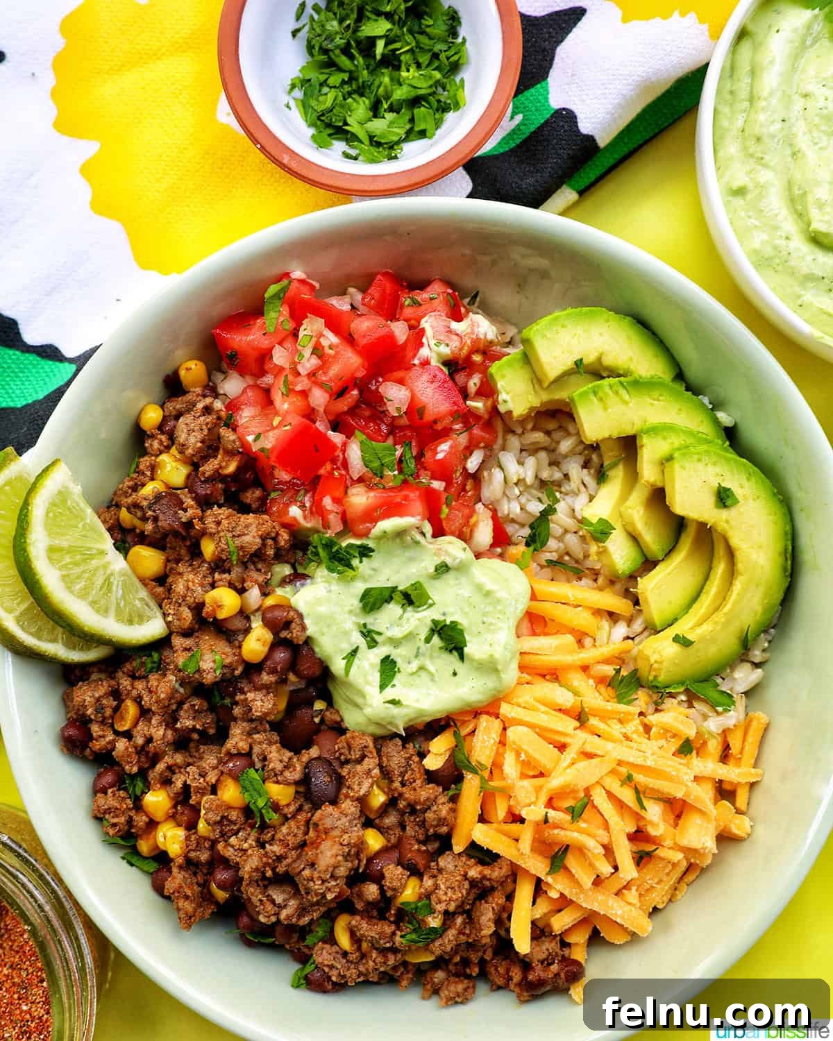 Effortless Fiesta Bowls 3 Taco bowl filled with brown rice, beef, beans, corn, and tomatoes.