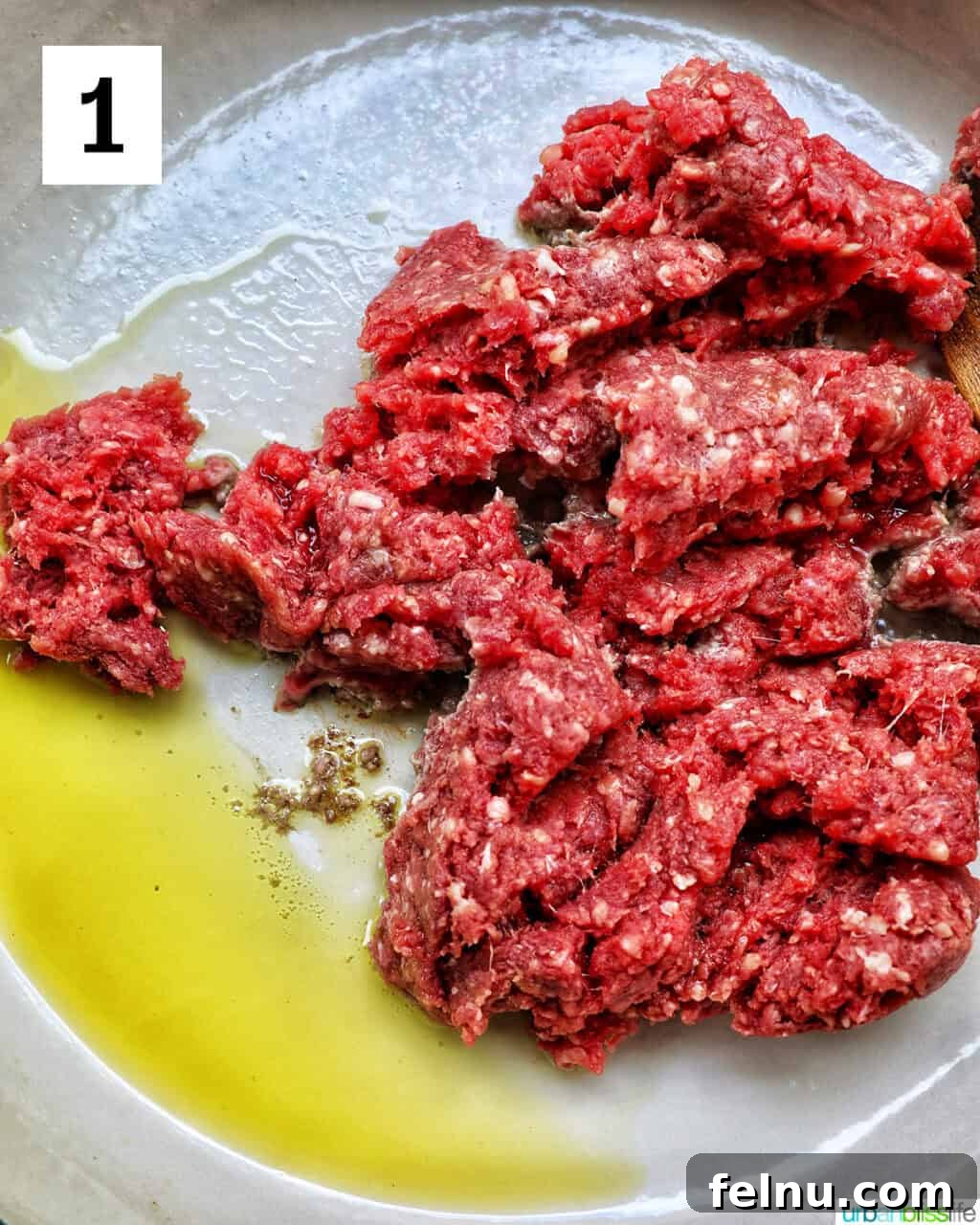 Effortless Fiesta Bowls 5 Ground beef and olive oil cooking in a pan.
