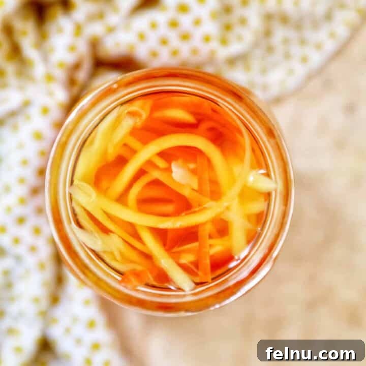 Filipino Atchara: Sweet and Sour Papaya Pickle 17 Mason jar with Filipino Atchara condiment - papaya, carrots, red bell pepper, garlic, ginger.