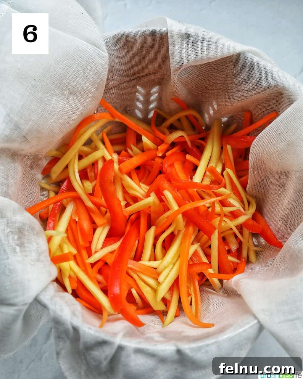 Filipino Atchara: Sweet and Sour Papaya Pickle 10 Brined vegetables placed in a clean bowl after rinsing, ready for squeezing.