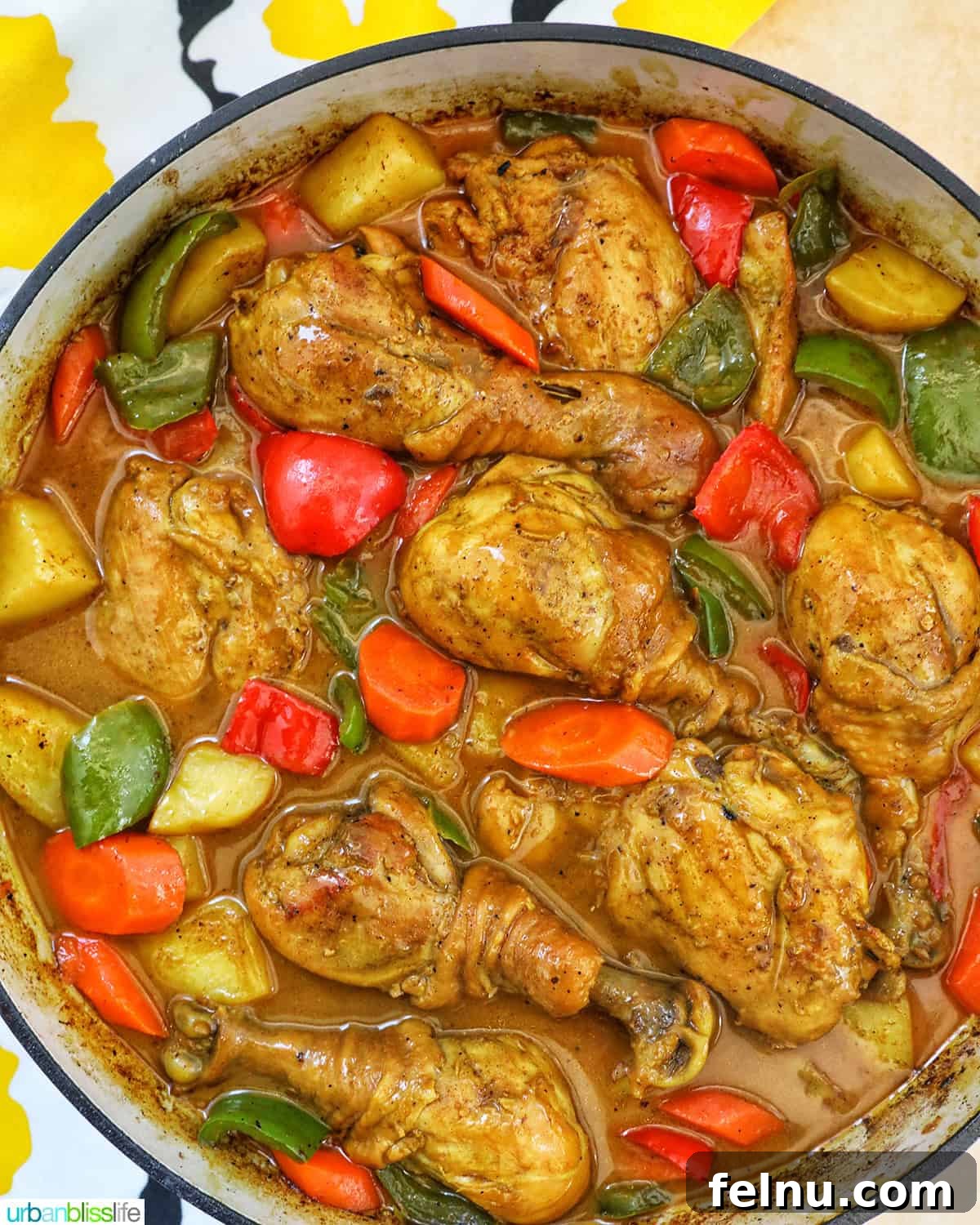 Filipino Chicken Curry
Authentic Chicken Adobo Curry Fusion 2 Filipino Chicken Curry with vegetables in a large pan.