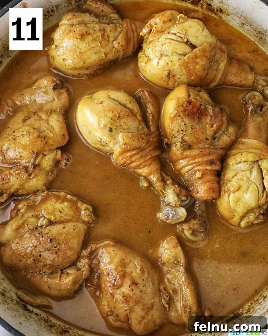 Filipino Chicken Curry
Authentic Chicken Adobo Curry Fusion 15 Chicken cooking in curry sauce in a large pan.