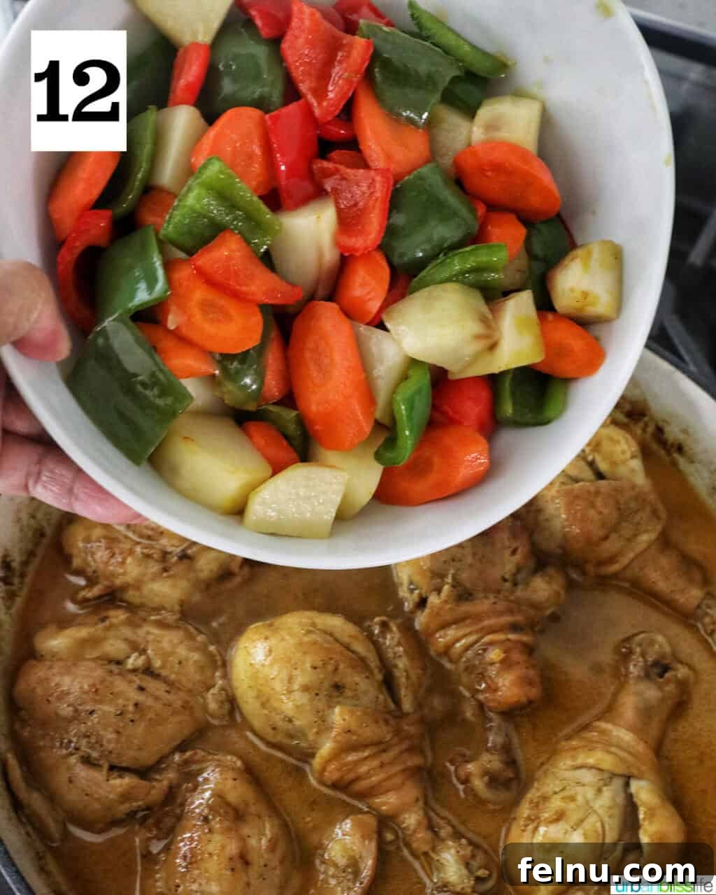 Filipino Chicken Curry
Authentic Chicken Adobo Curry Fusion 16 Bowl of chopped vegetables over a pan of curry chicken.