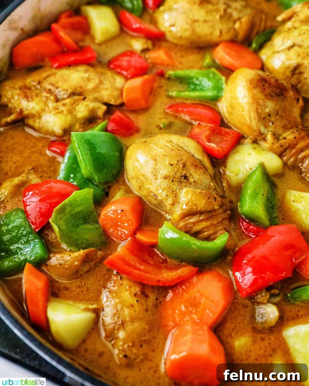 Filipino Chicken Curry
Authentic Chicken Adobo Curry Fusion 17 Filipino Chicken Curry with vegetables in a large pan.