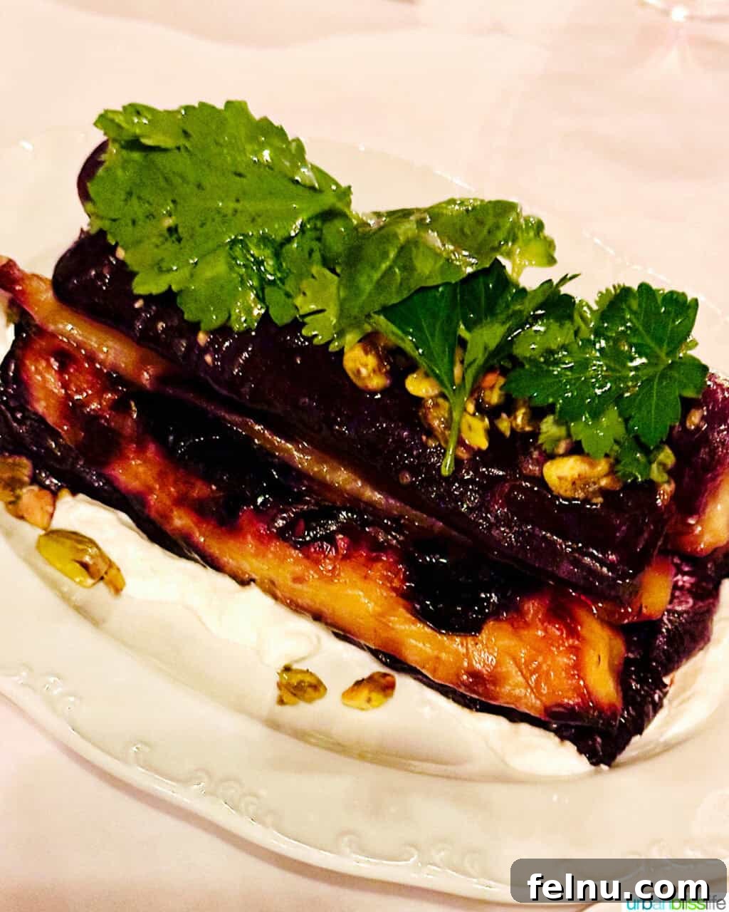 Via Carota NYC: West Village's Authentic Italian Experience 7 A delightful plate of charred carrots, complemented by creamy yogurt, pistachios, and fresh herbs at Via Carota.