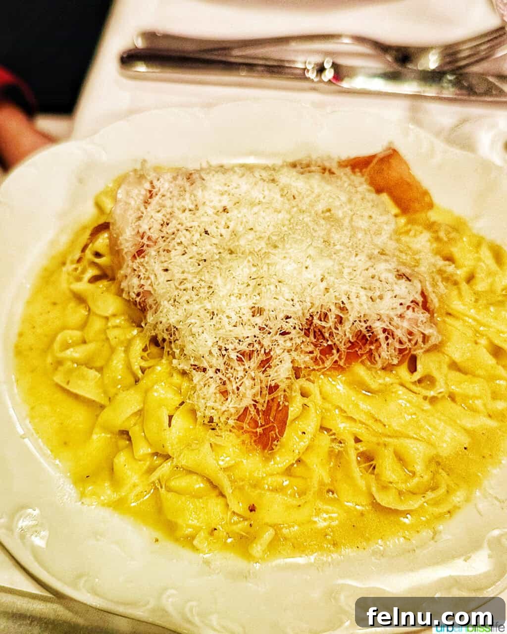Via Carota NYC: West Village's Authentic Italian Experience 9 A comforting bowl of Tagliatelle pasta, enriched with Parmigiano and prosciutto, demonstrating Via Carota's mastery of pasta dishes.